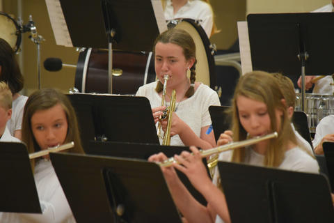 Girl playing trumpet at Music Festival.